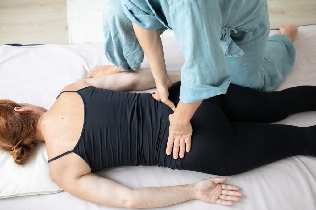Shiatsu session in a bright, calm practice room